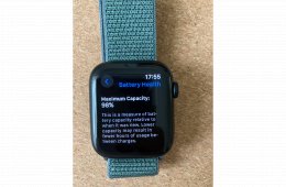 Apple Watch SE GPS + Cellular, 44 mm-es éjfekete alumíniumtok, tózöld sportpánt